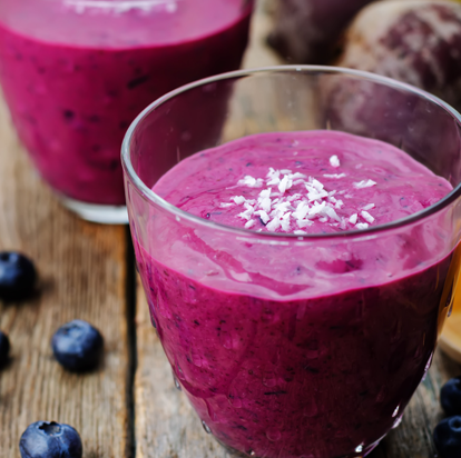 Purple smoothie in a glass, representing plant-based protein fortification.