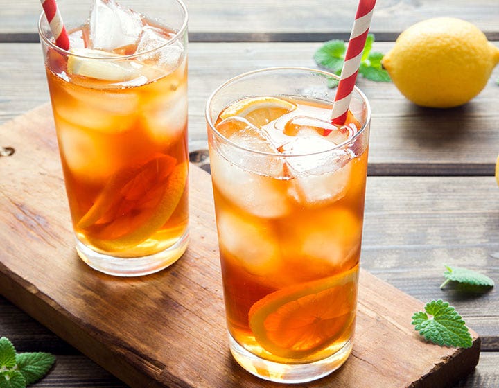 Glasses of iced tea on a table, representing coffee and tea ingredient solutions