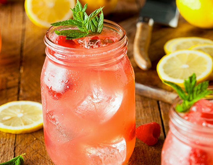 Glass of sparkling water with fruit garnish, showcasing flavored and carbonated beverage solutions