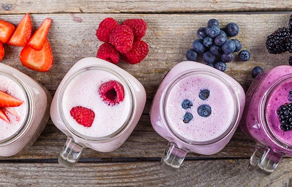 Yogurt cups with berries, representing nutrition beverage applications